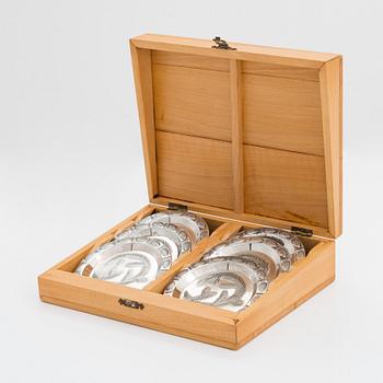 A set of six spruce cone motif coasters, Auran Kultaseppä, Turku 1968. In original wooden box.