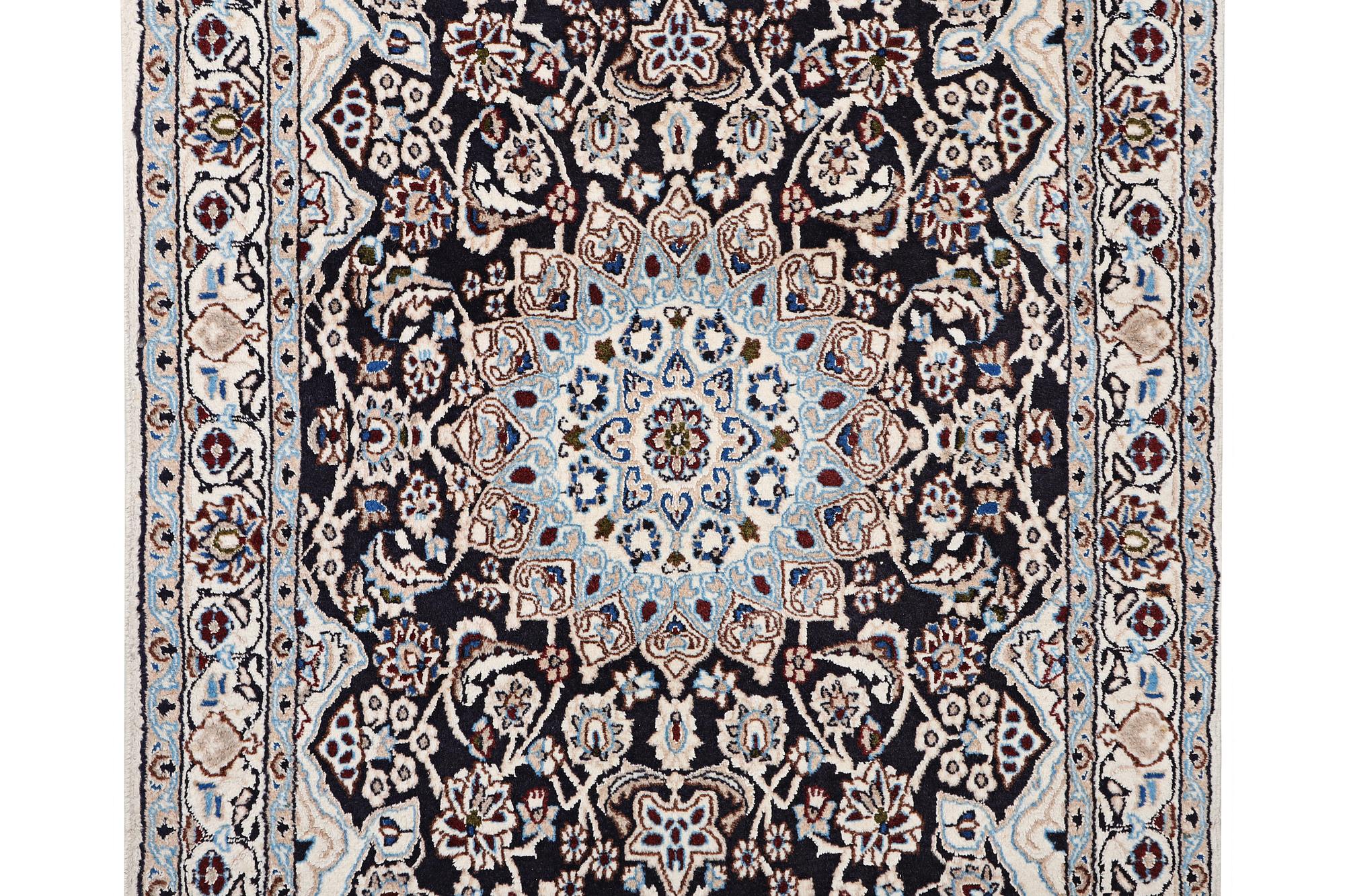 A Nain rug, part silk, 9 laa, c. 210 x 119 cm.