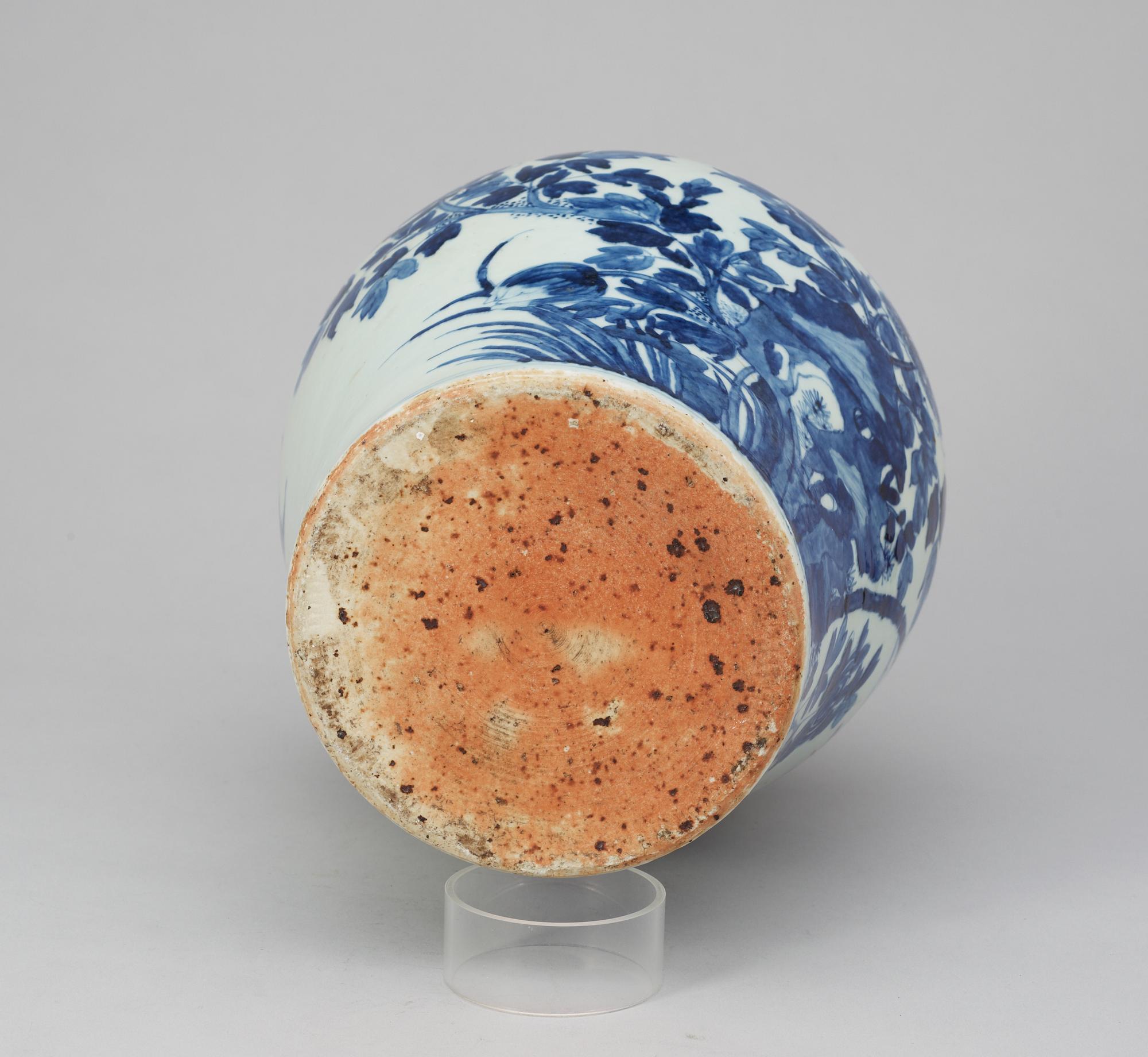 A blue and white Qing dynasty urn.