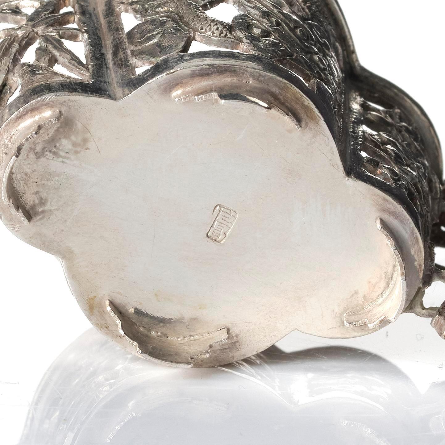 A pair of  Chinese silver cup holders/salts, 20th century.