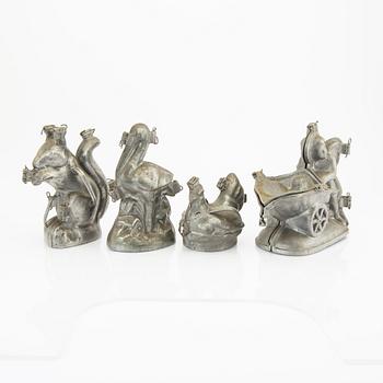 A set of four pewter icecream moulds around 1900.