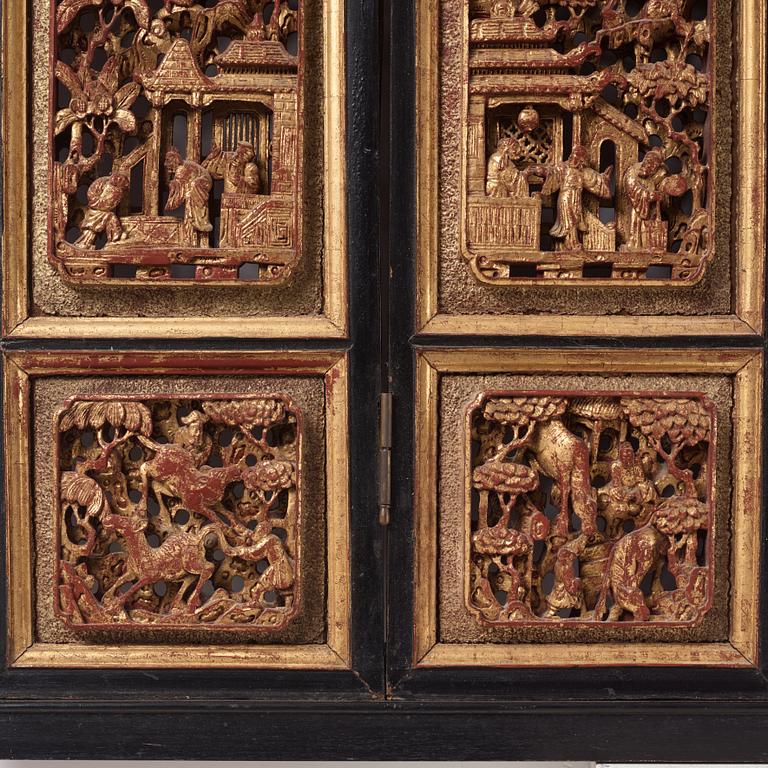 A set of four framed wooden panels, Qing dynasty, 19th Century.