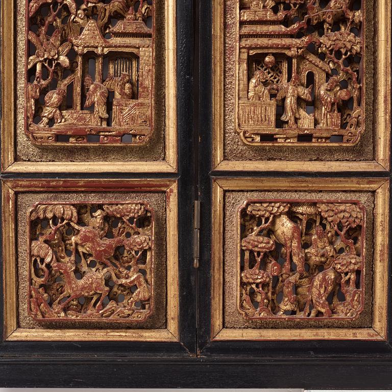 A set of four framed wooden panels, Qing dynasty, 19th Century.