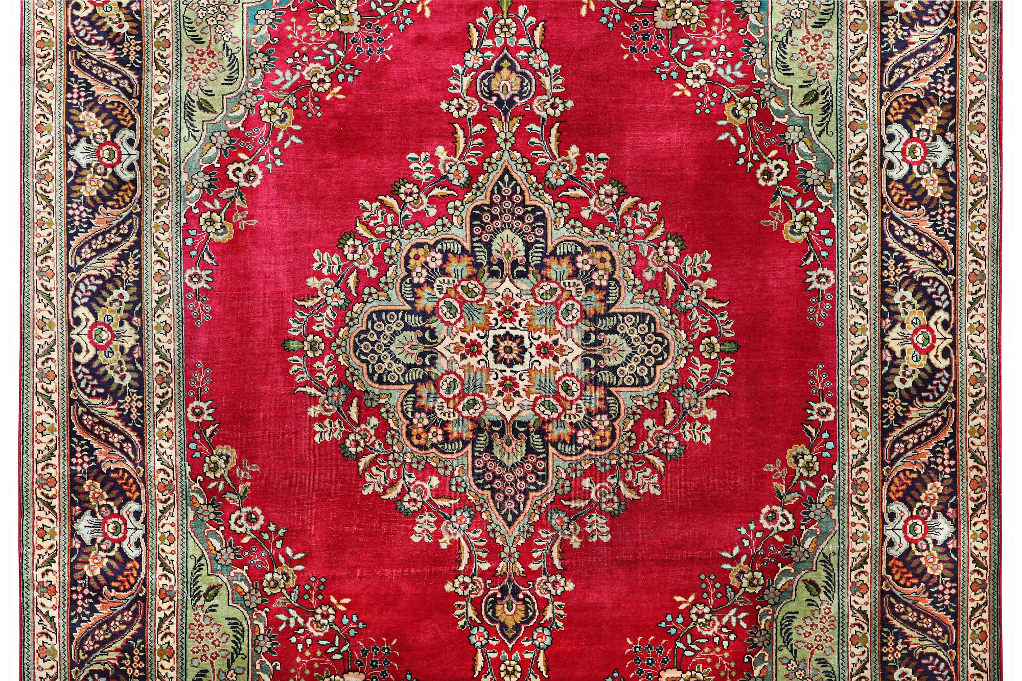 A Tabriz carpet, c. 330 x 250 cm.