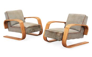 A pair of Alvar Aalto 'no 400' birch armchairs, O.y Huonekalu-ja Rakennustyötehdas A.B for Artek, Finland ca 1939.