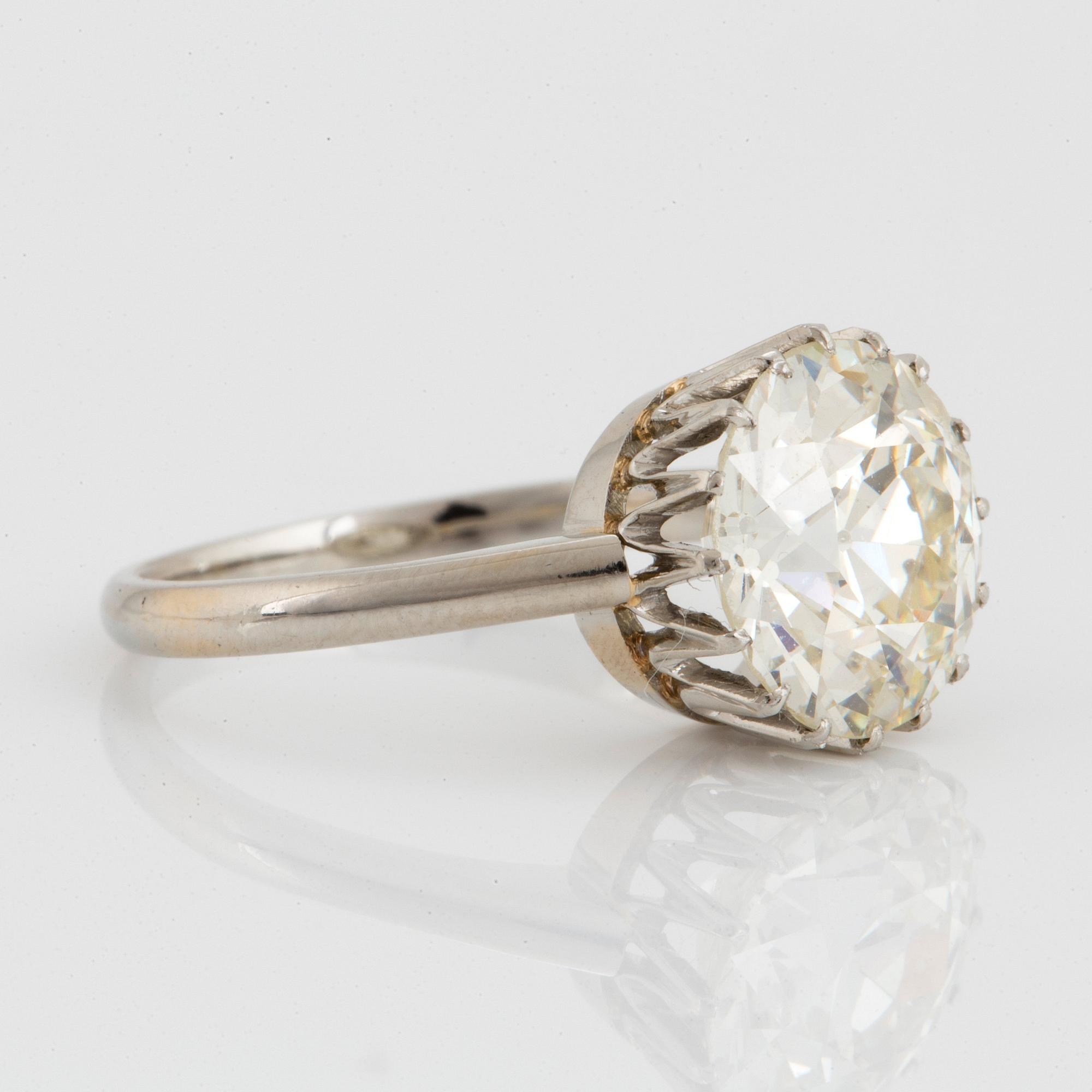 An 18K white gold ring set with an old-cut diamond ca 3.80 cts quality ca J/K vs.