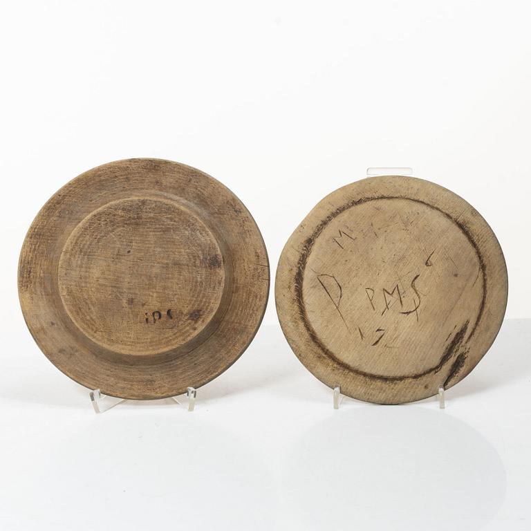 Twelve wooden plates, 19th Century.