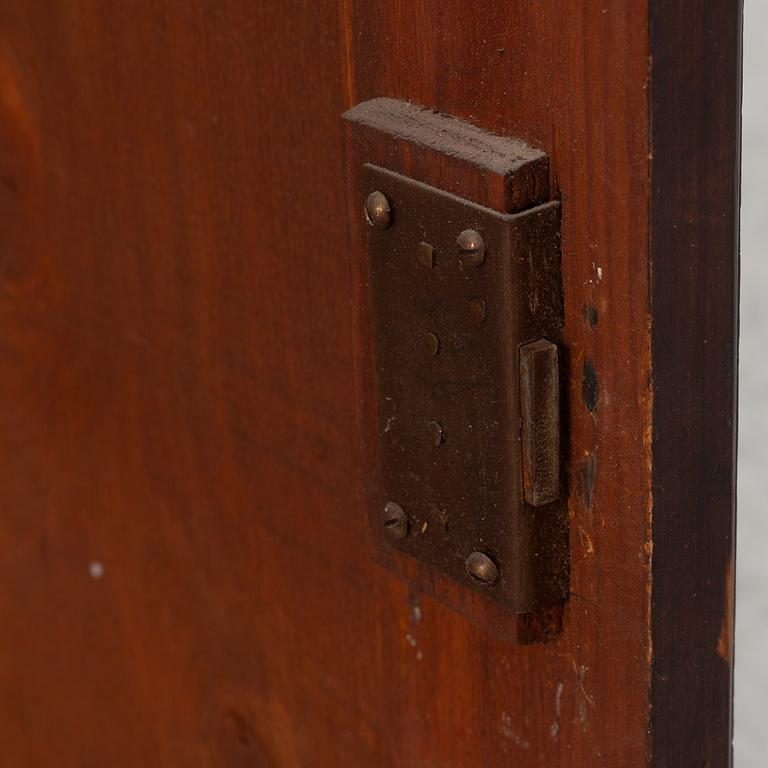 A wall cabinet, dated 1843.