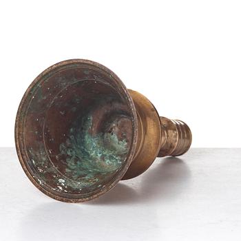 A CANDLESTICK, bronze/copper alloy, Ottoman, Turkey 16th-17th century, height 24 cm, the foot diameter 15,5 cm.