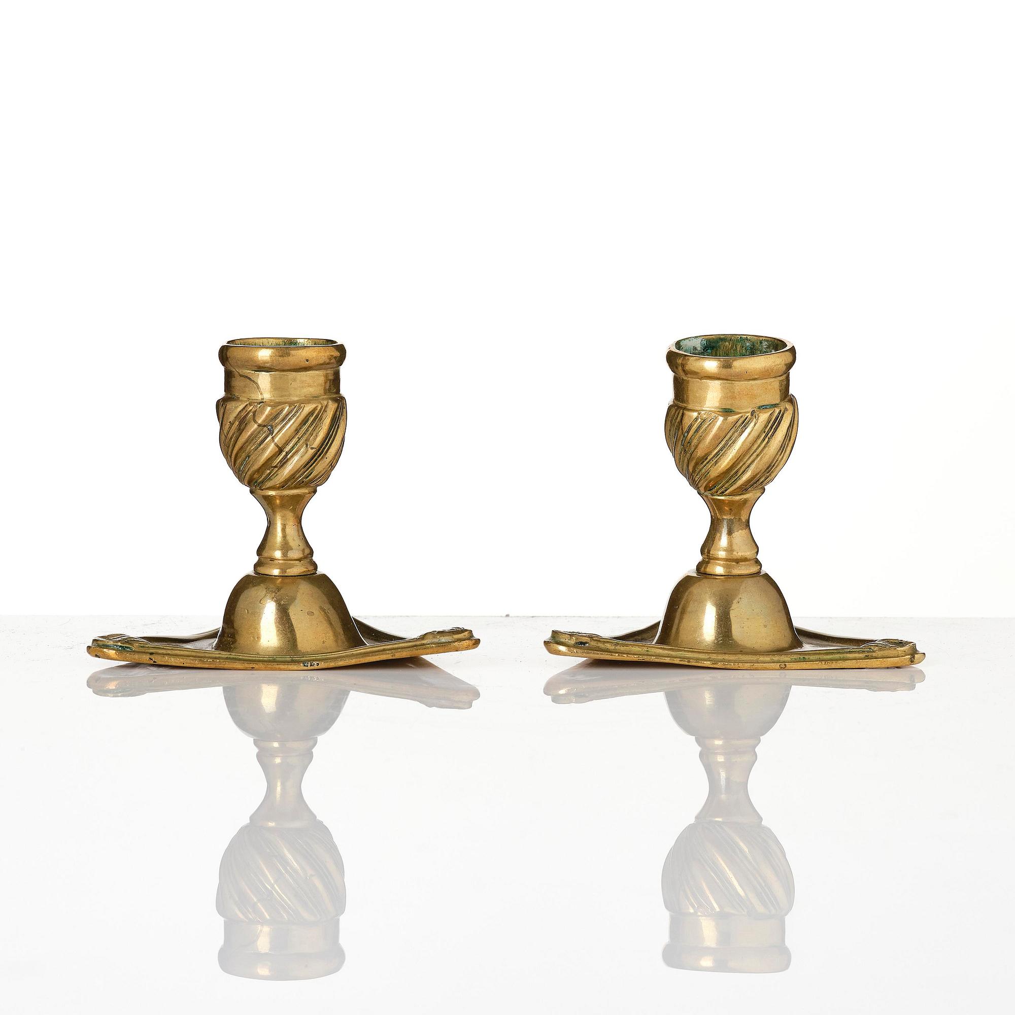 A pair of rococo brass candlesticks by Petter Hemming (master in Stockholm 1771-1807), 1772.