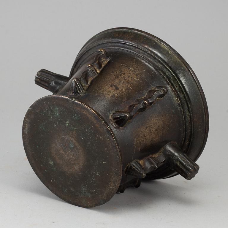 A 16th century bronze mortar.