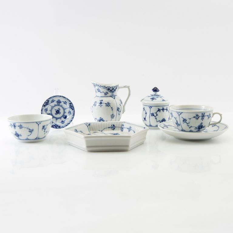 Service approximately 42 pieces "Musselmalet rifflet/halvblonde" Royal Copenhagen Denmark porcelain first half of the 20th century.