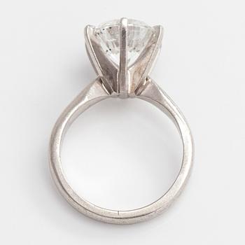 A platinum ring, with a brilliant-cut diamond approximately 3.10 ct. Domino Jewellery, Birmingham, England.