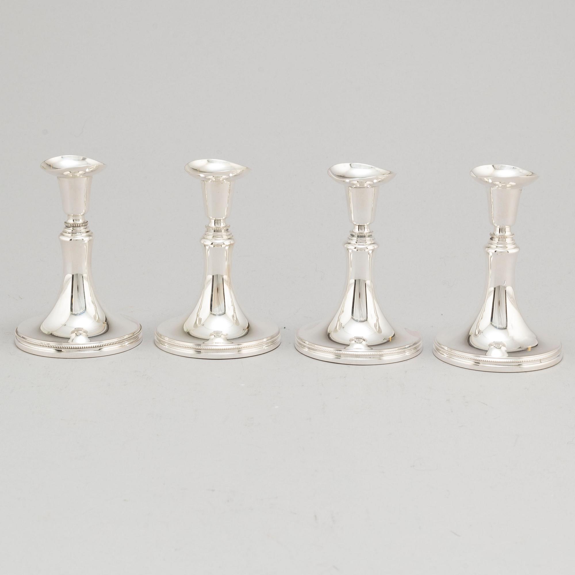 A set of four Swedish silver candlesticks, maker's mark Erik Löfman, Uppsala 1971-1973.