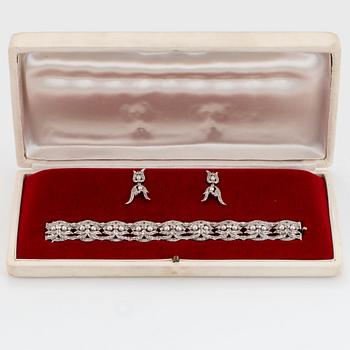 A platinum bracelet and a pair of earrings set with pearls and old-, eight- and rose-cut diamonds.