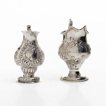 Two creamers, a tray, and a sugar tongs, silver, Rococo and Rococo style, 18th-19th century.