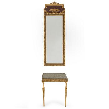a bronzed mirror and a console table from the second half of the 20th century.