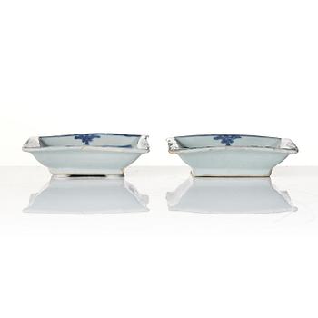 A pair of blue and white 'lotus' dishes, Ming dynasty (1368-1644).