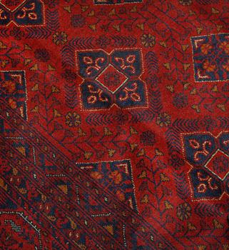 An Afghan carpet, 343 x 243 cm.
