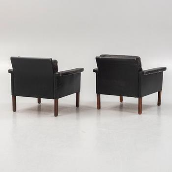 A pair of leather armchairs, Mio, Sweden, 1960's.