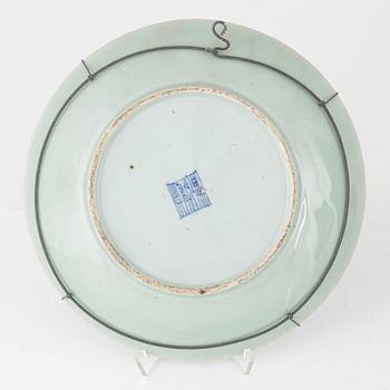 A Kanton porcelain dish and two porcelain plates, China, 19th century.
