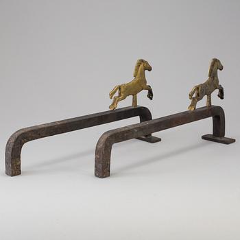 A PAIR OF IRON AND BRASS ANDIRONS by Tore Kullander, Borås 1943.