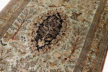 A Ghom, figural, silk rug, c. 205 x 140 cm.