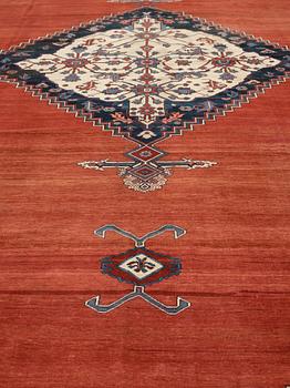 A CARPET, an antique Bakshaish, ca 693 x 398,5 cm, dated "1298"AH/1880 AD probably.