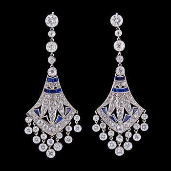 1233. A pair of Art Deco sapphire and diamond chandelier earrings, tot. app. 7.40 cts, c. 1925.