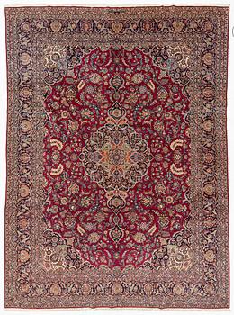 A semi-antique Kashan carpet, c 435 x 325 cm.