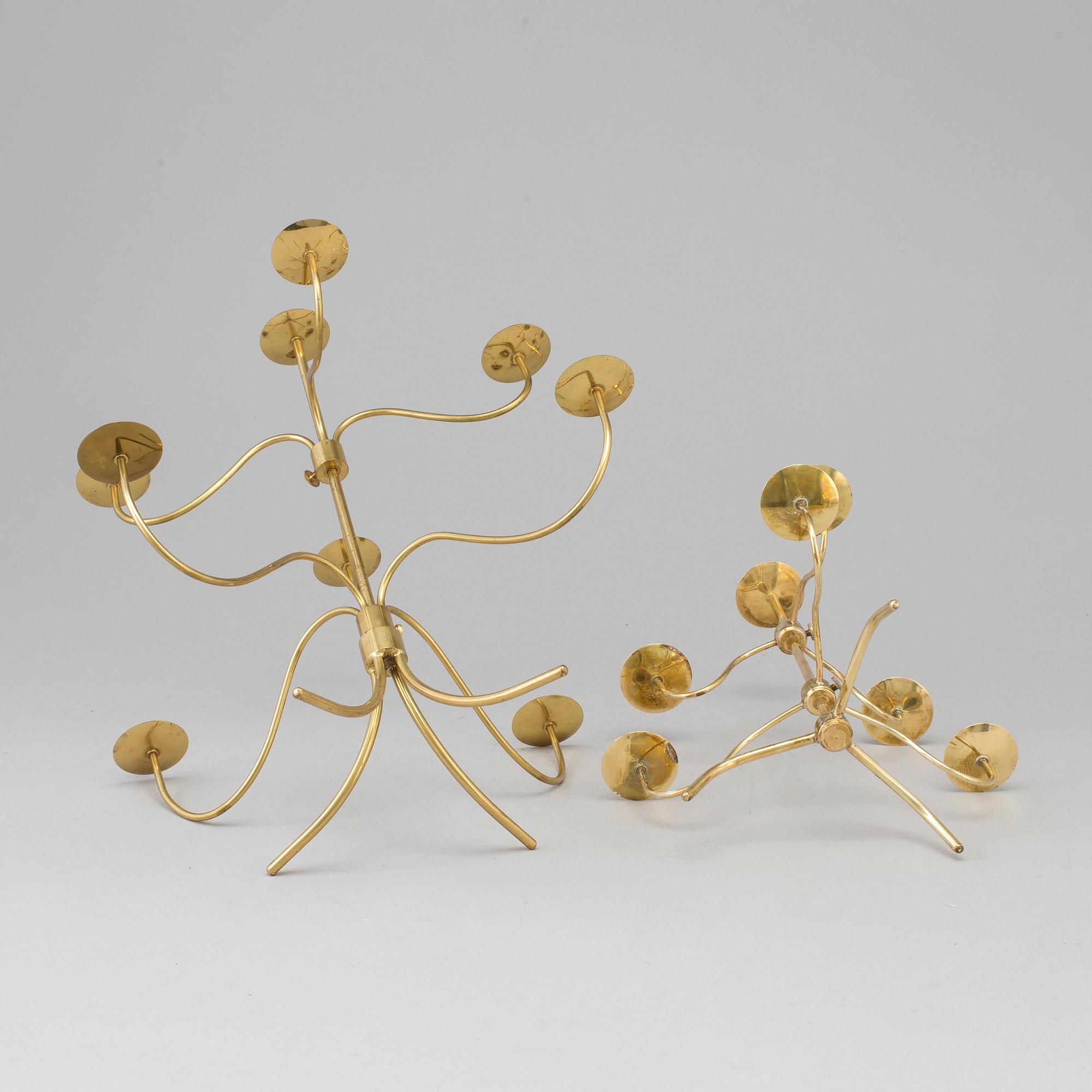 Two brass candelabra, designed by Josef Frank. Firma Svenskt Tenn.