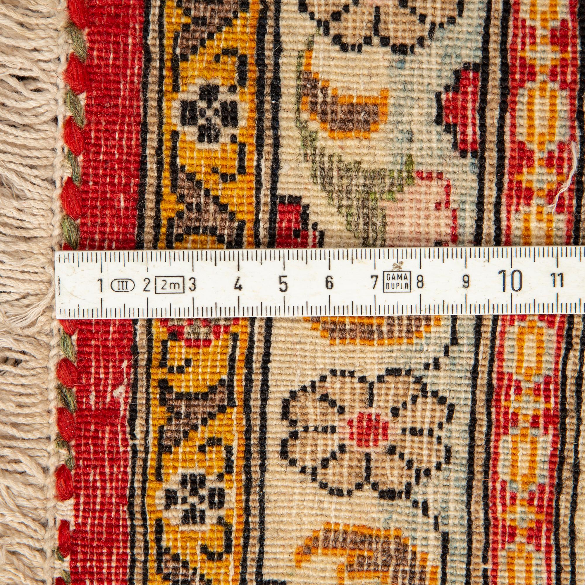 A CARPET, semi-antique Qum, ca 341 x 238 cm.
