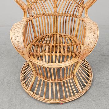 GIO PONTI & LIO CARMINATI, A 'Conte Biancamano' rattan Wingback Armchair for Bonacina, Italy.