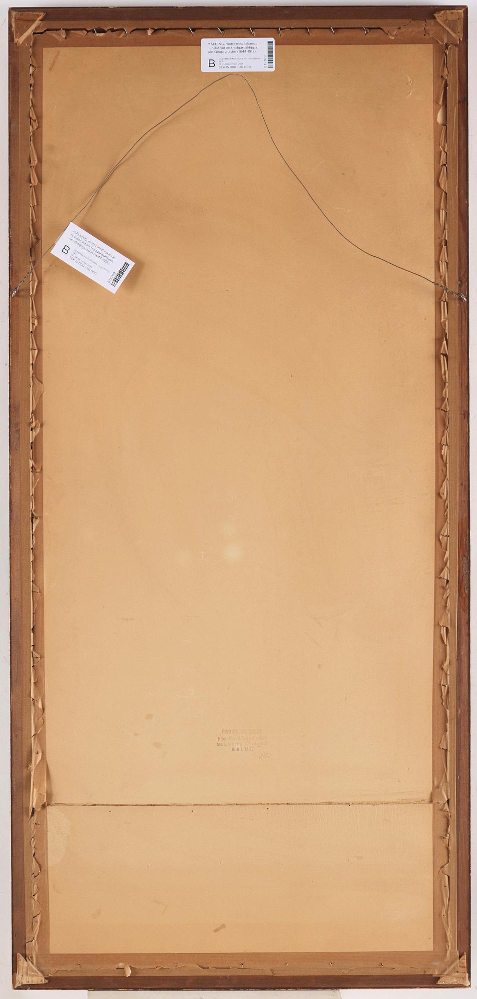 A painting of two playing dogs in front of a garden rock, late Qing dynasty (1644-1912).