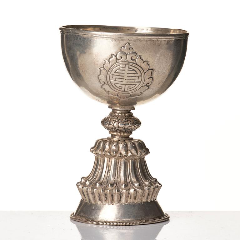 A Tibetan butter lamp, silvered copper, 20th Century.