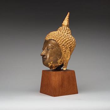 A gilt bronze head of Buddha, Thailand, 19th Century.