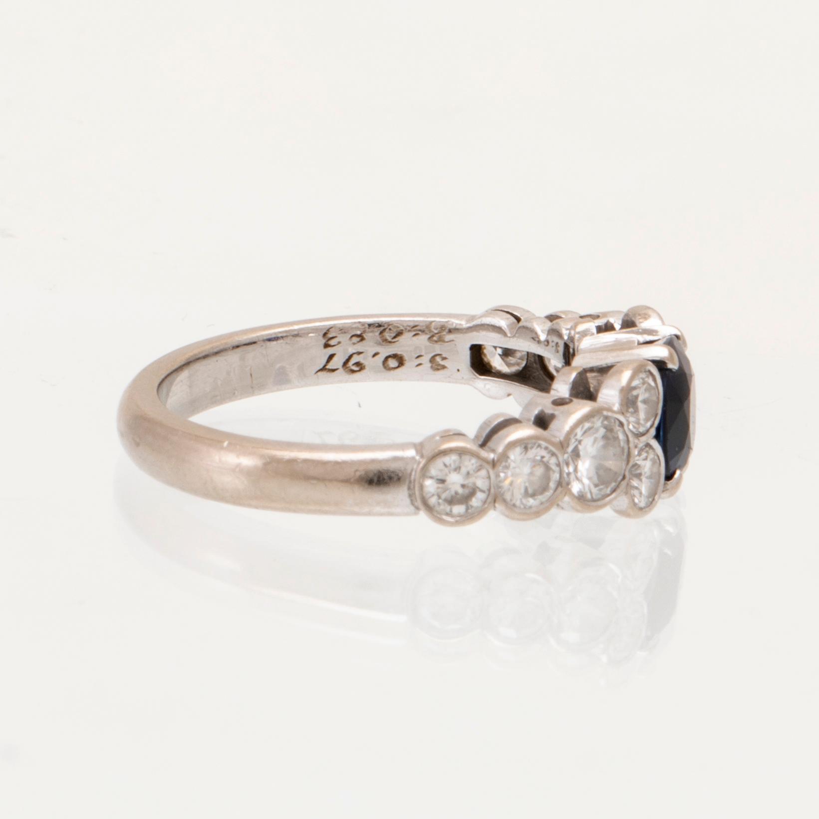 An 18K white gold ring set with an oval faceted sapphire and round brilliant-cut diamonds, Sengels Goldsmith Stockholm.