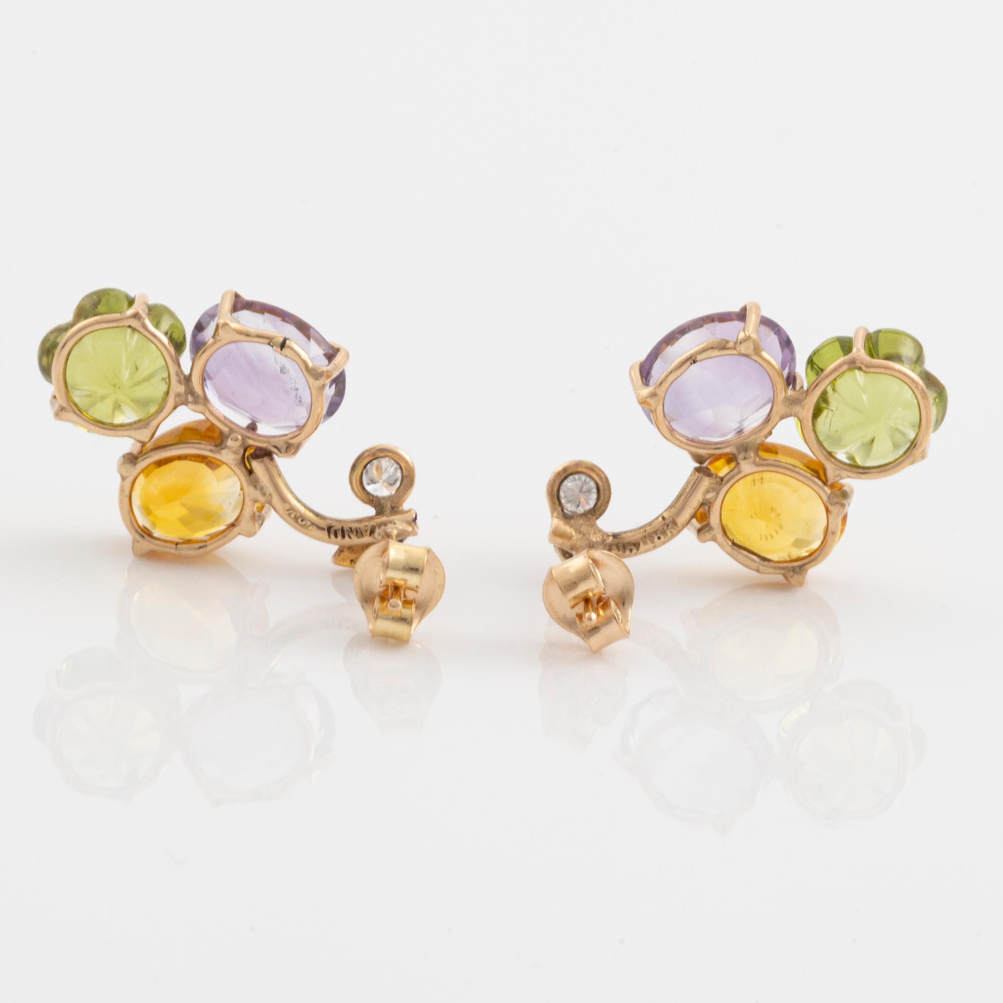 Earrings with yellow sapphires, cut flower-shaped peridot, amethyst, and brilliant-cut diamonds.