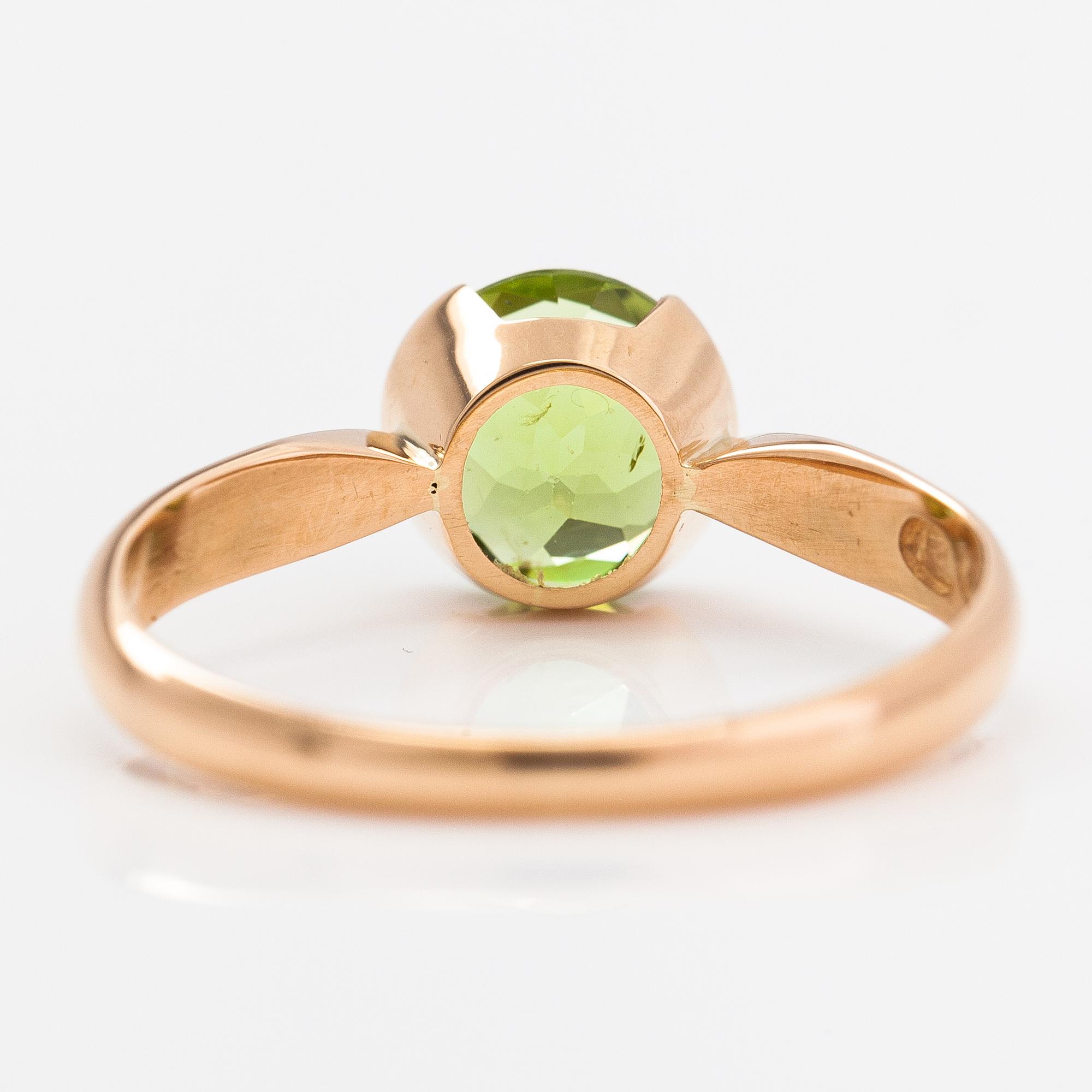 Ring, 18K guld och peridot. Kultateollisuus, Åbo 1917.