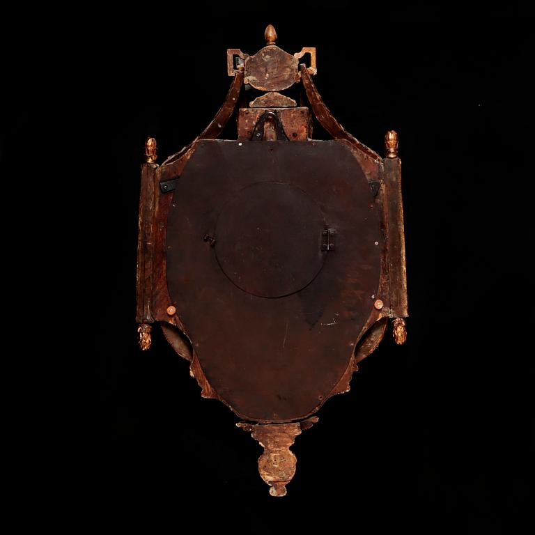 A Gustavian wall hanged clock, dial marked "Jacob Kock Stockholm", maded in the second half of the 18th century.