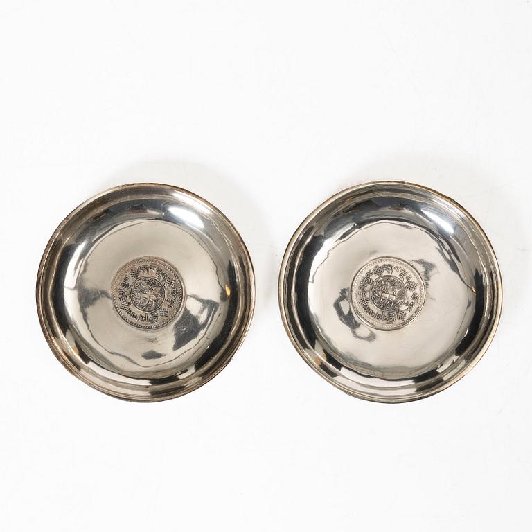 A pair of Thai silver coasters, 20th century.