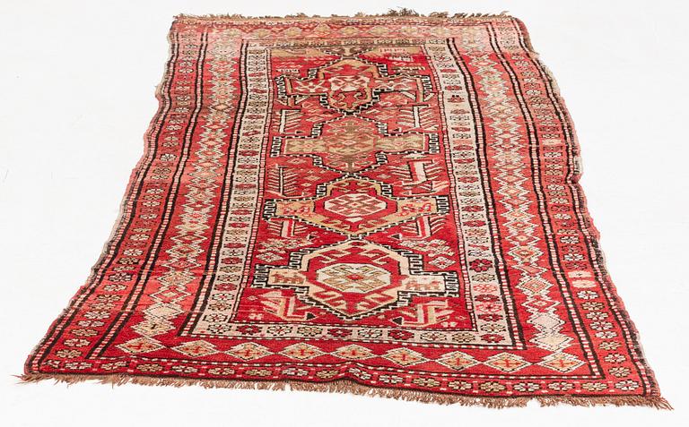 An oriental semi antique carpet, circa 272 x 120 cm.