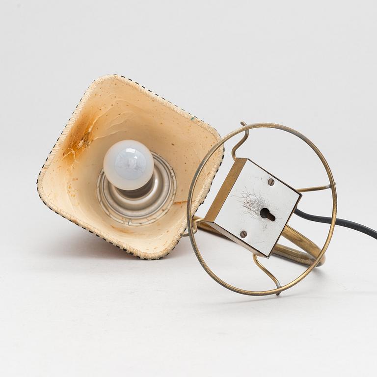 A mid-20th-century table lamp
/wall light for Idman.