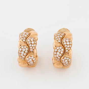 CHOPARD, a pair of "Casmir" earrings set with brilliant cut diamonds.