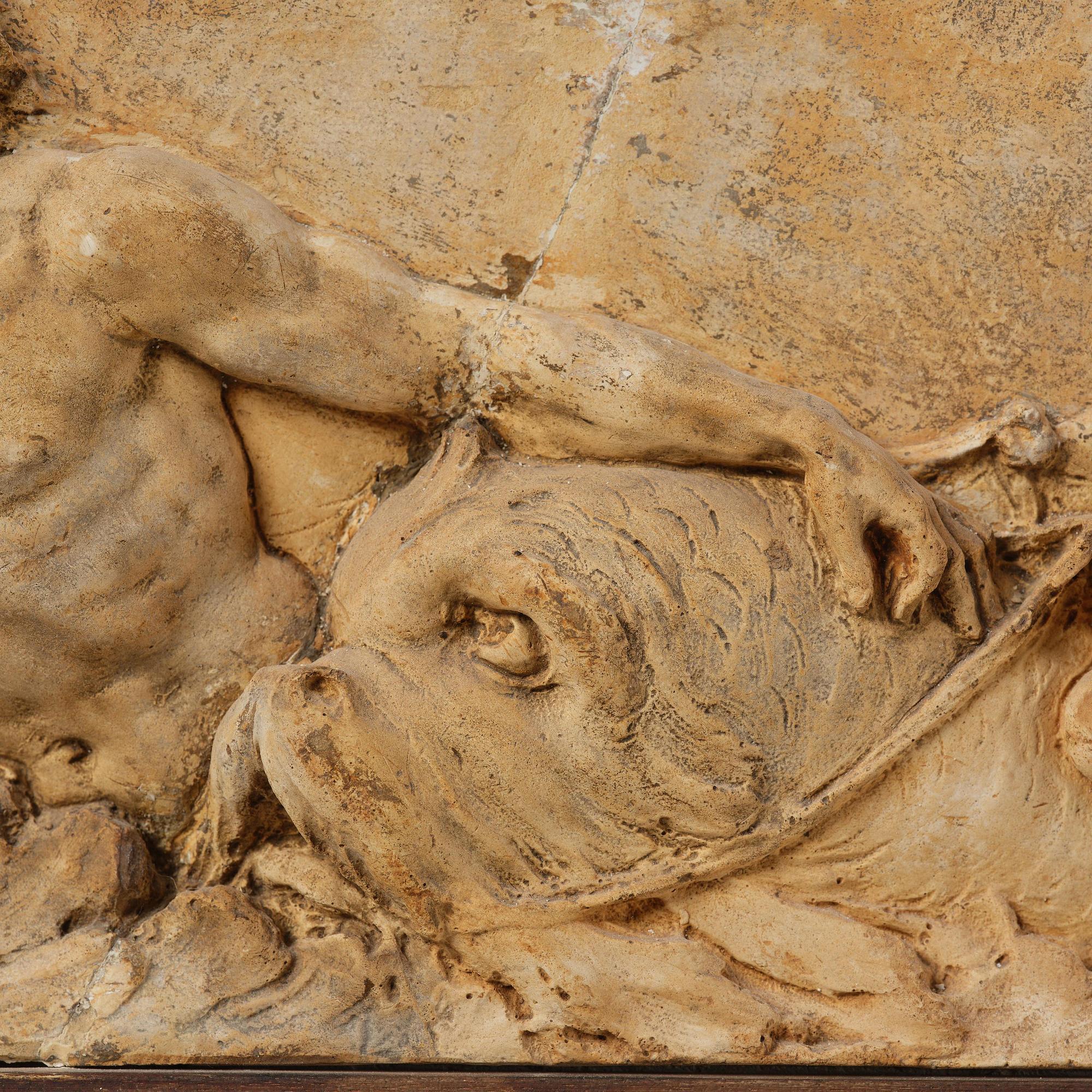 Claude Michel Clodion, attributed to, A relief depicting a nereid riding a dolphin alongside a triton blowing into a conch.