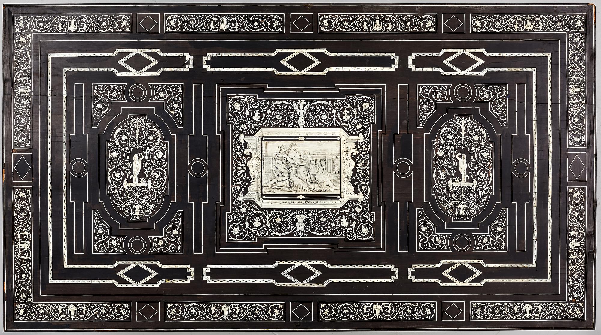 A Renaissance-style ebony, ebonized and ivory-inlaid library table, late 19th century, presumably Germany.