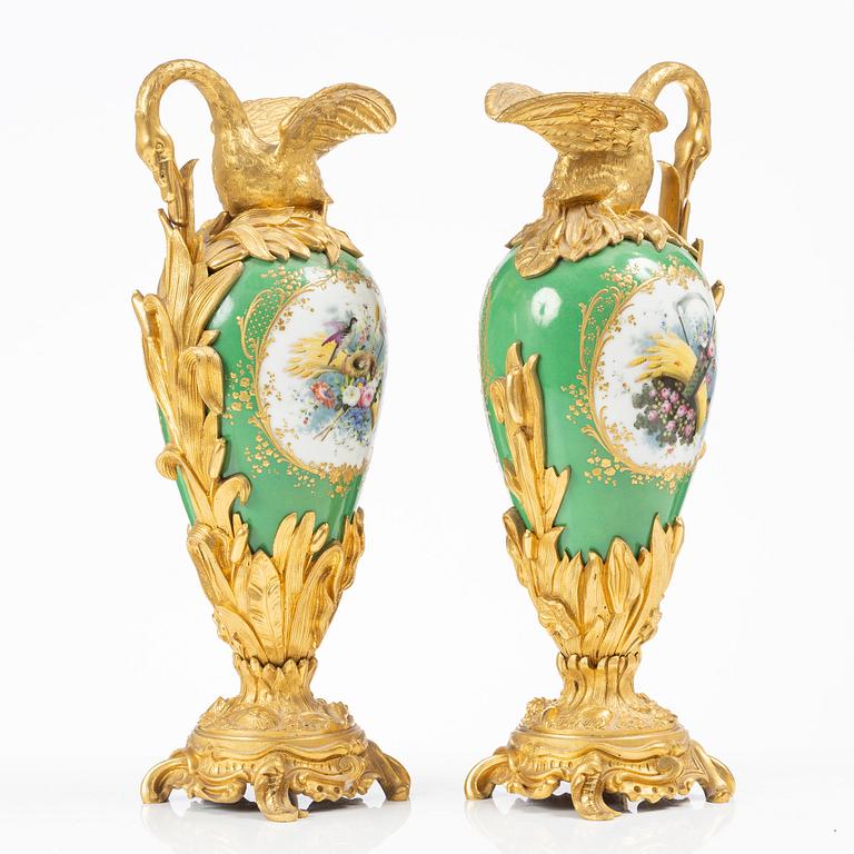 A pair of Louis XV-style gilt bronze and porcelain decorative ewers, France, later part 19th century.