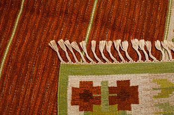 A flat weave by Berit Woelfer, signed BW, third quarter of the 20th century, 238 x 197 cm.