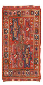 CARPET. "Rektangeln". Knotted pile. 284 x 148 cm among which about 11 cm at each end is polychrome flower patterned flat weave. Signed MMF.