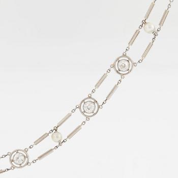 A NECKLACE with round brilliant-cut diamonds and pearls.